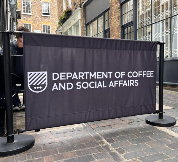 Black cafe posts with fabric barrier graphic